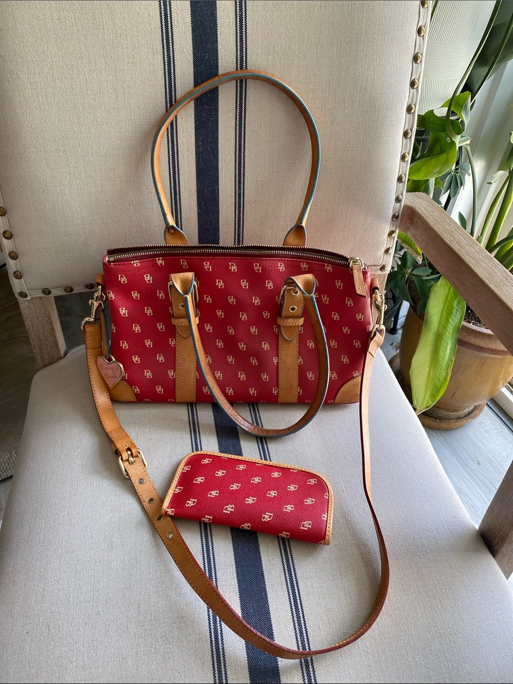 Dooney & Bourke Red Satchel with Tan Trim WITH matching sunglass case.